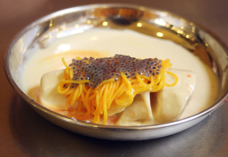 Dessert of pistachio kulfi with saffron noodles.