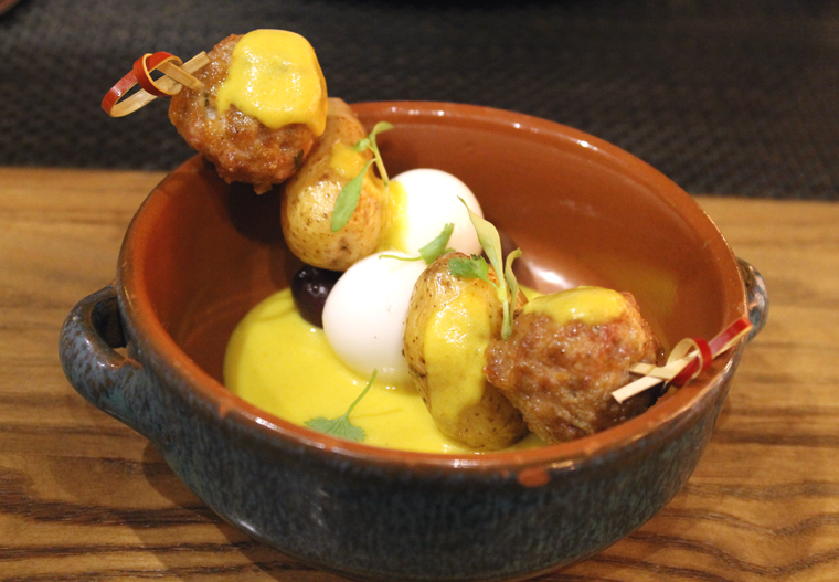 Skewers of chicken meatballs and quail eggs.