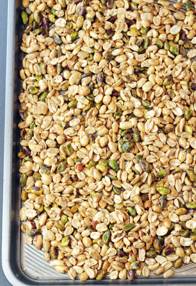 Peanuts and pistachios tossed in spices, and ready to get toasted in the oven.