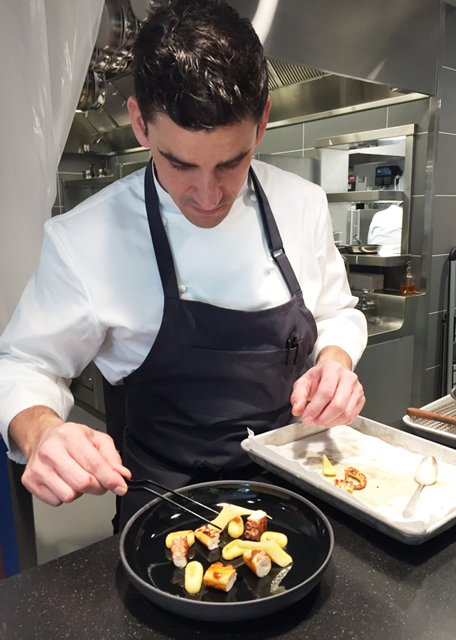 Head Chef Anthony Secviar readying a dish a few weeks before the grand opening.