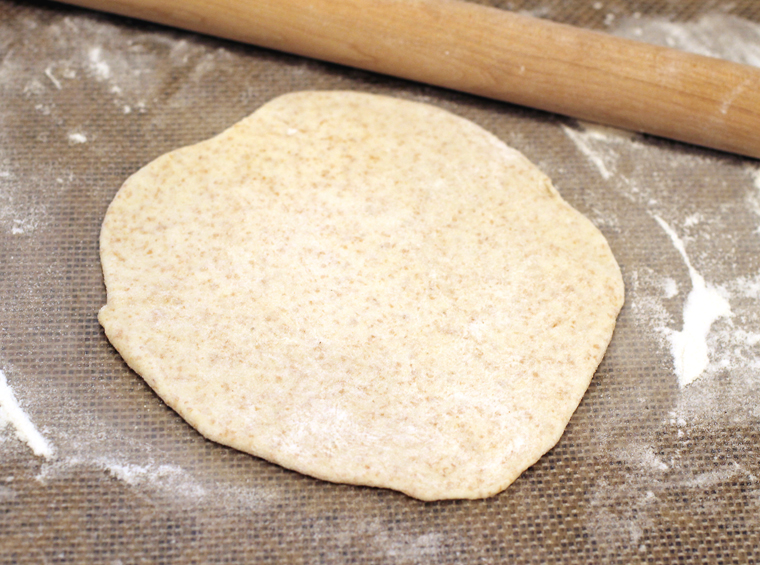 Flattened round of dough.