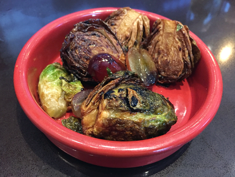 Crisp, sweet and tangy Brussels sprouts -- a freebie snack you can choose with your drink during "Happy Hour.''