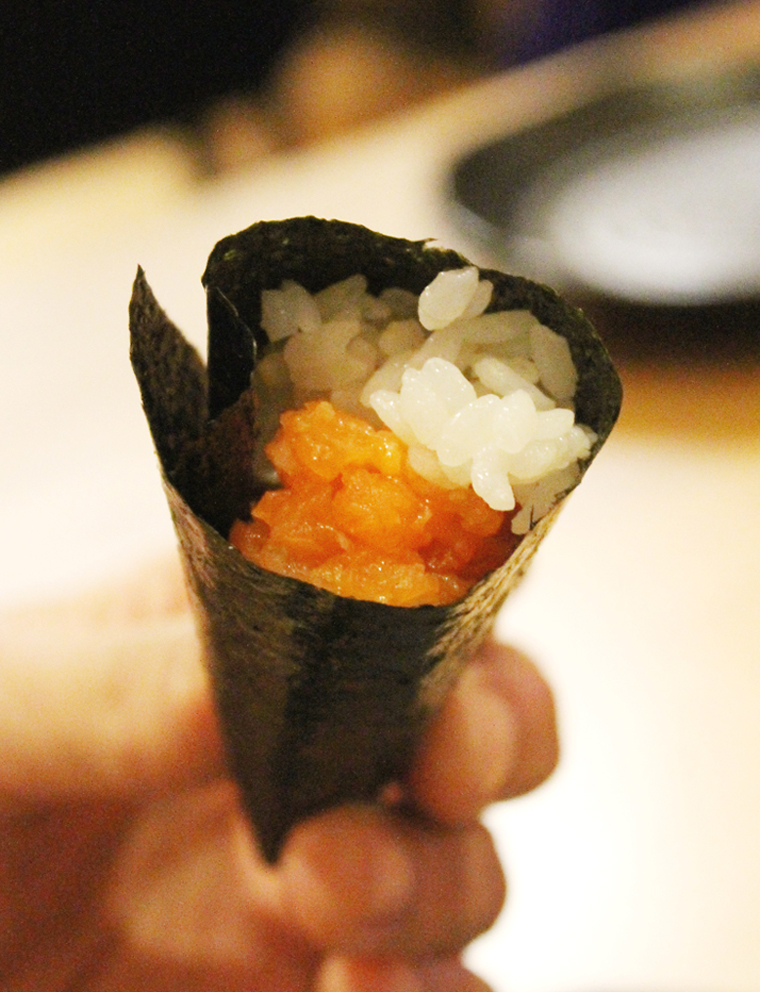 Salmon hand-roll made to order with warm rice -- available at the bar at Ozumo.