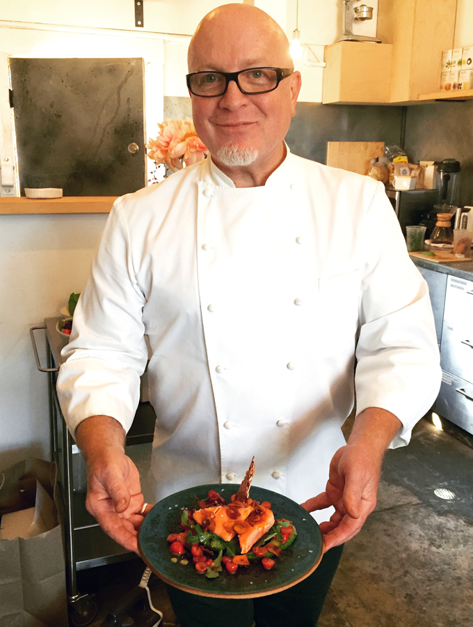 Chef Paul Canales of Oakland's Duende with a salmon dish ready to go before the cameras.