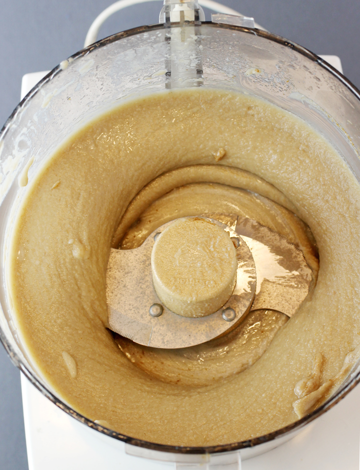 Whizzing the tehina or tahini with lemon juice and spices.
