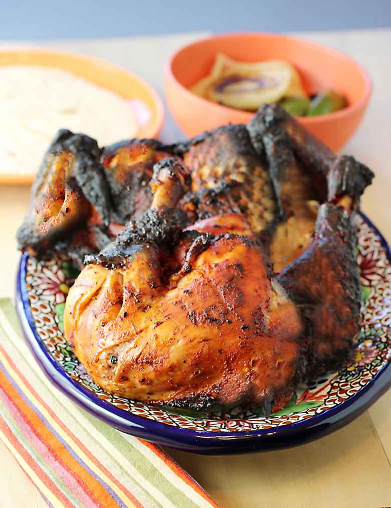 A family-style feast of chile-marinated chicken, grilled veggies and warm corn tortillas.