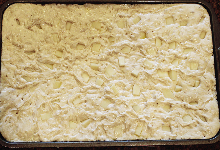 After the final proof, the dough has risen to hug the cheese cubes.