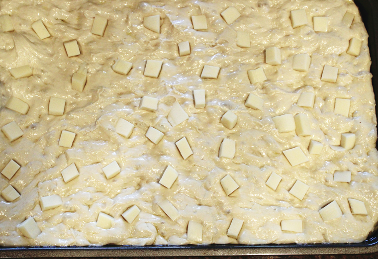 Half the cheese cubes are added while the dough continues to proof.