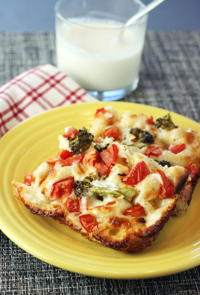 A creamy sauce with more garlic and cheese gets drizzled on top of the finished pizza.