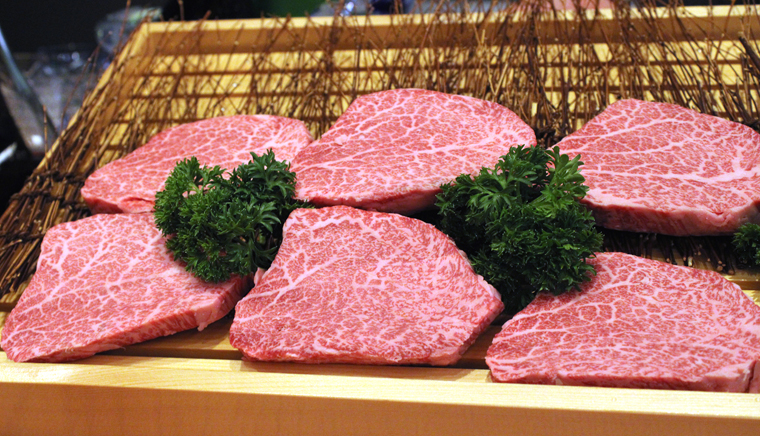 The slabs of Drunken A5 Wagyu are shown to guests before being cooked.