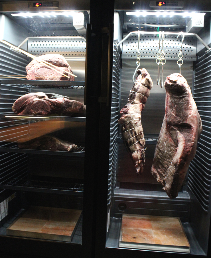 Wagyu being dry-aged for 15 to 60 days. Note the pink salt slabs underneath to help draw out moisture.