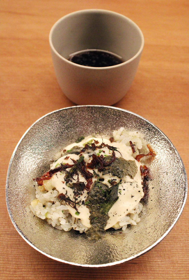 Rice served in an artsy tin bowl that is actually bendable. It's served with Wagyu "tea.''