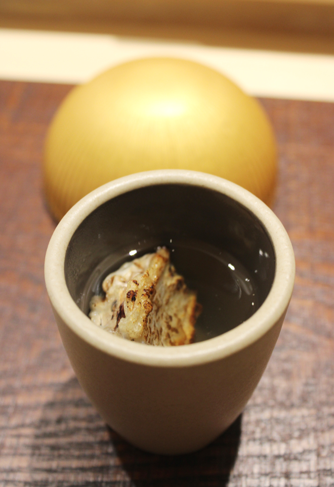 ...served with warm sake infused with roasted bone from the fish.