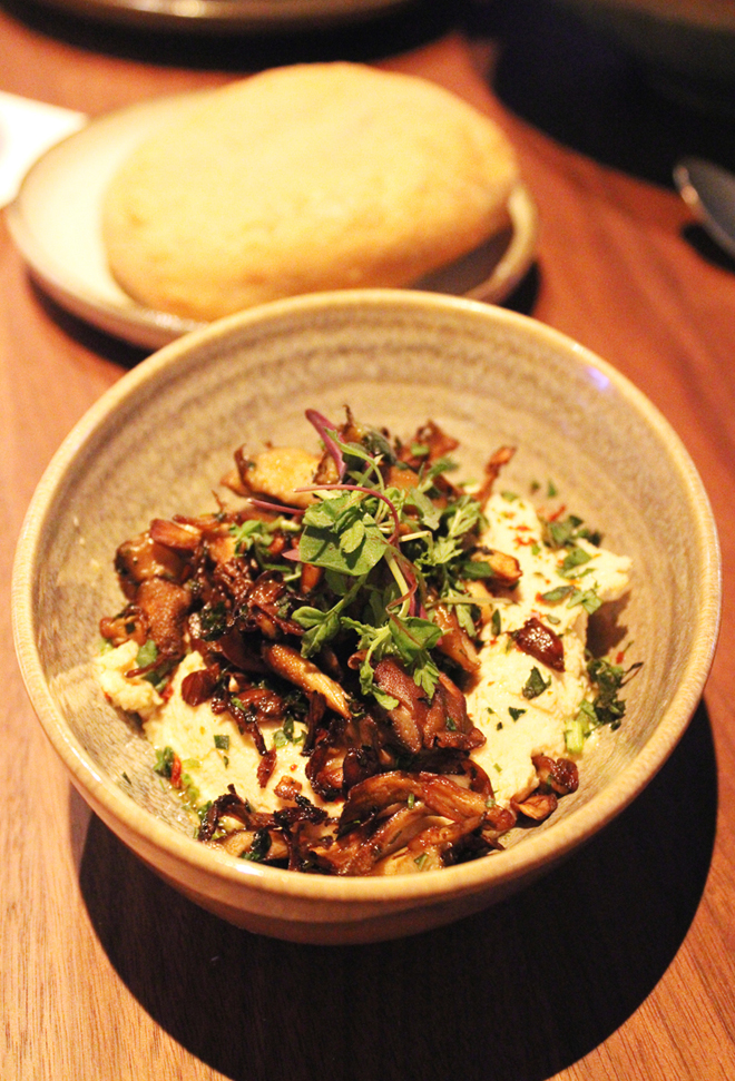 Fried pita with mushroom-topped hummus.