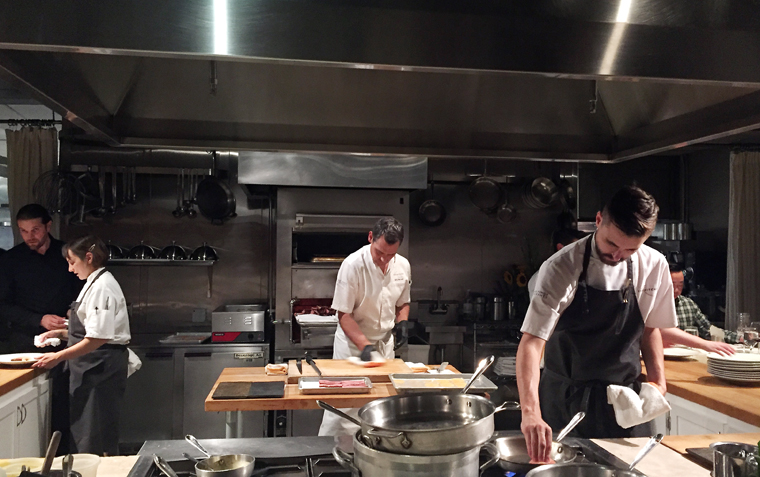 Executive Chef Kelly McCown at the center of the open kitchen.