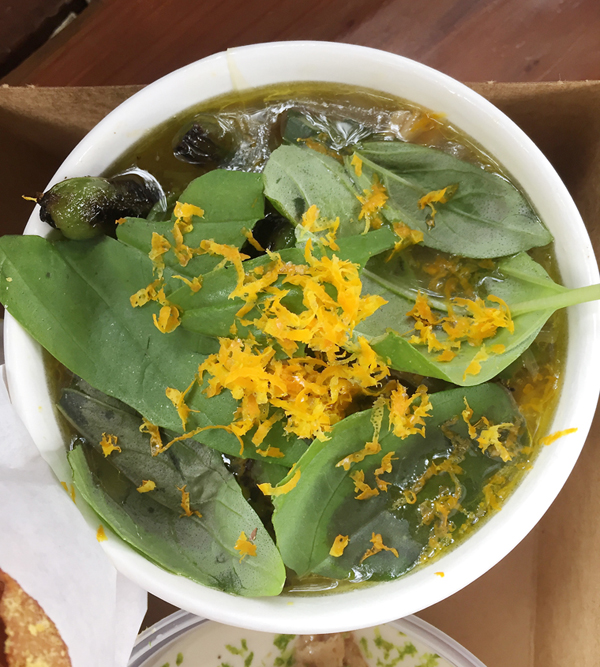 Orange zest and fresh spinach leaves finish this mushroom and pea soup at Dad's Luncheonette.
