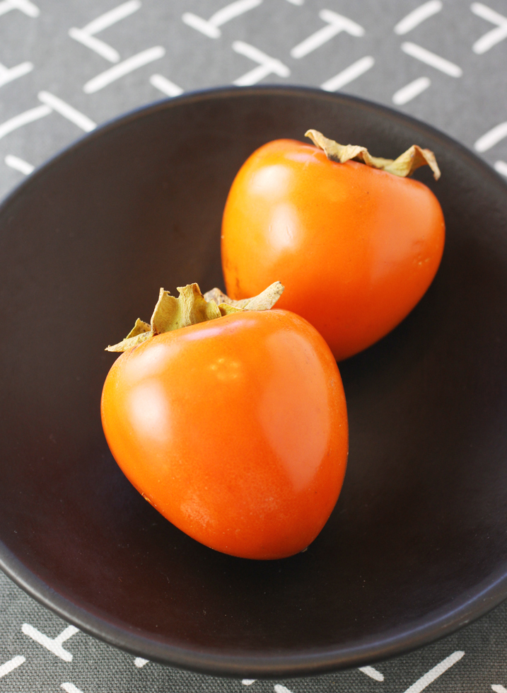 These are Hachiya persimmons. They are heart-shaped, while the Fuyus are more squat (like the felt one in the top photo).