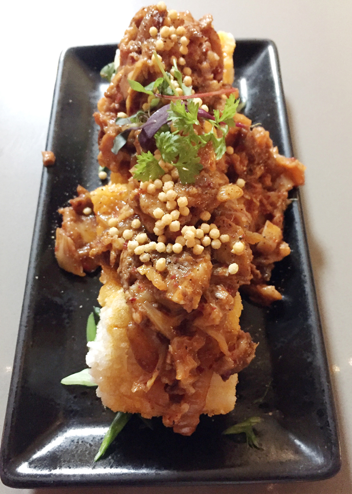 Fried tofu with spicy pork and kimchi at Tapas Tokki.