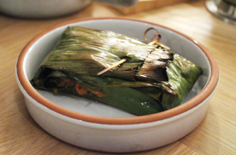 Black cod wrapped in leaves.