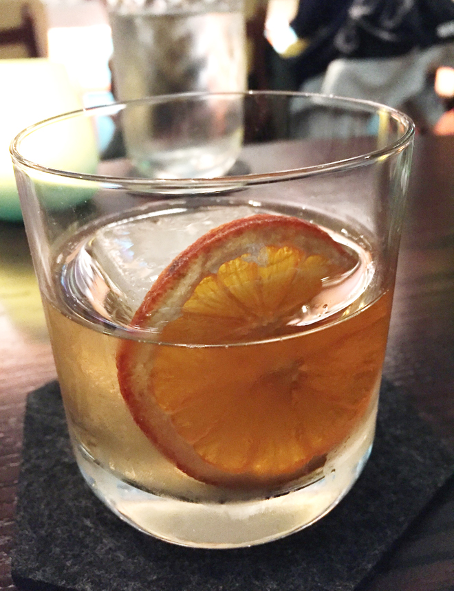 A wheel of orange and a coconut-water ice cube garnish the Sgt. Doheny.