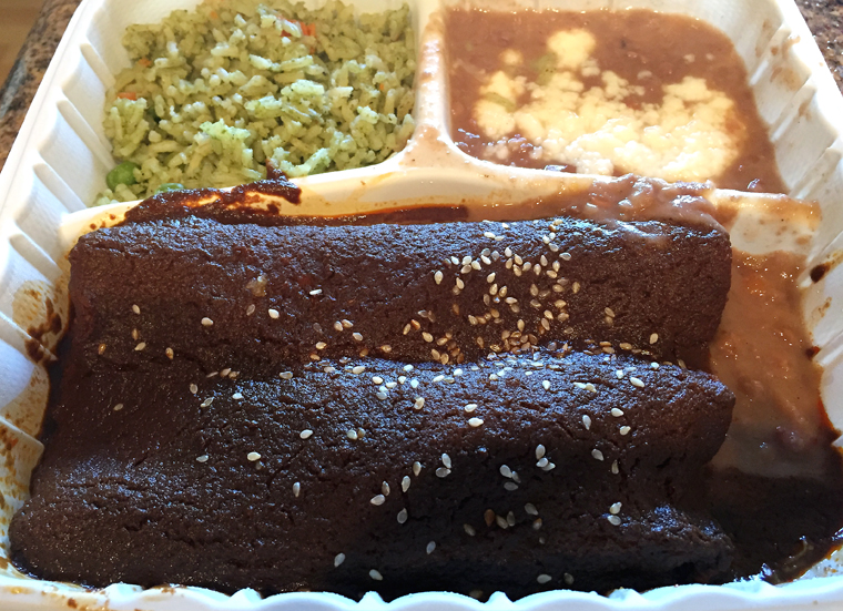 Two chicken mole enchiladas with arroz verde and Rancho Gordo beans.