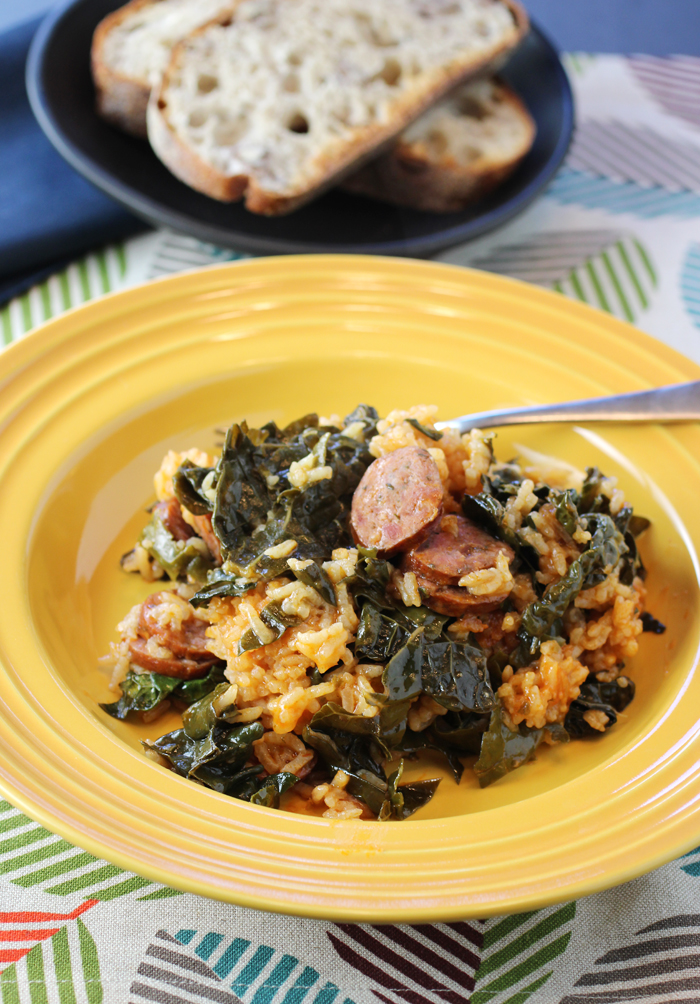 Coins of andouille sausage and tender kale leaves fortify this rice dish.