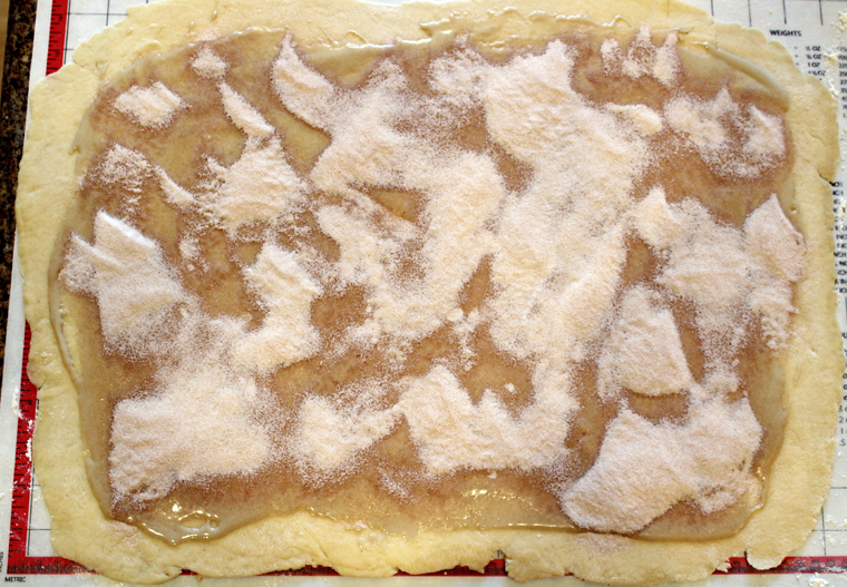 The rolled dough gets spread with the tahini first, then the cinnamon sugar.