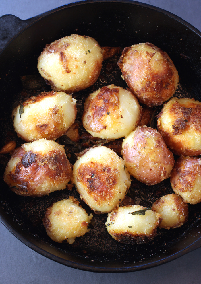 They cook in a hot oven in a cast-iron pan.