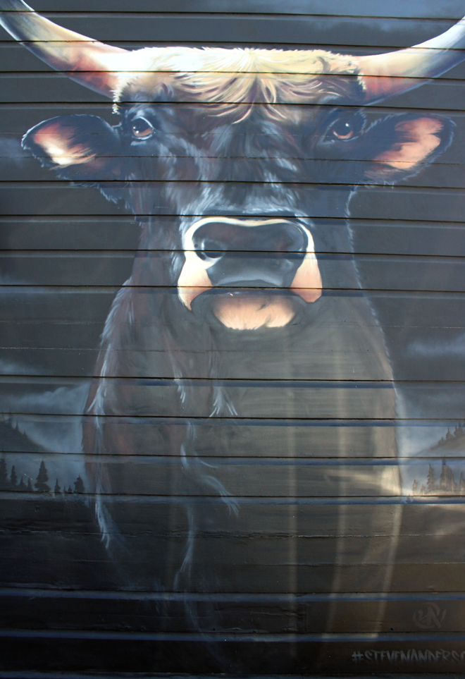 The striking mural of a bull at the front of the restaurant was created by Oakland artist Steven Anderson.