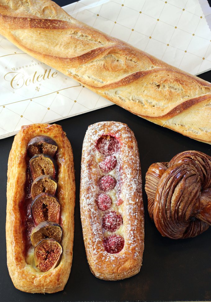 Baguette, fruit pastries, and dark chocolate twist pastry from Mademoiselle Colette.