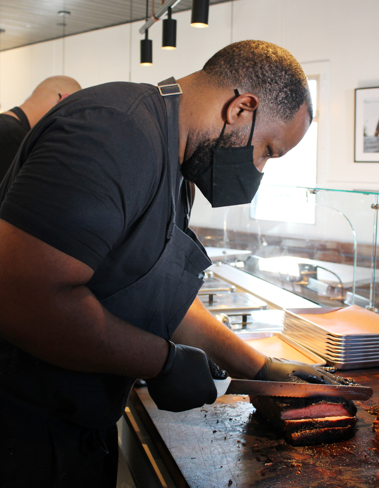 Matt Horn slicing brisket.