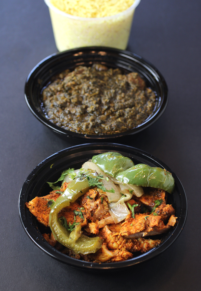 Grilled chicken boti (front), lamb with spinach (middle), and basmati rice (rear).