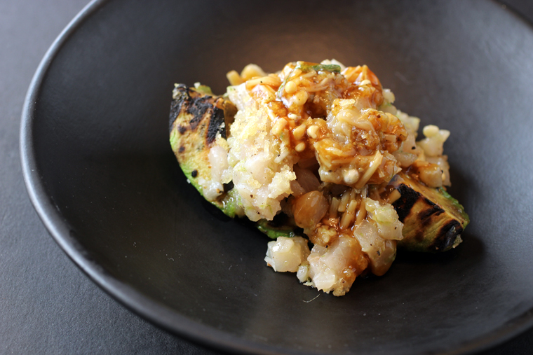 Hamachi tartare on a charred avocado.