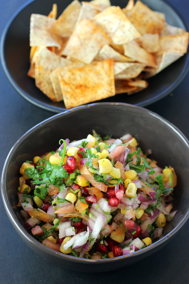 A side salad of pomegranate, mung bean, onions and corn, with crisp taro chips.