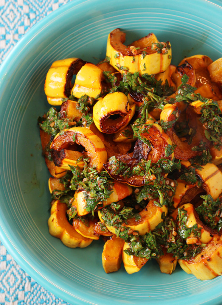 Crescent-slices of delicata squash get beautifully roasted in the oven until tender and sweet.