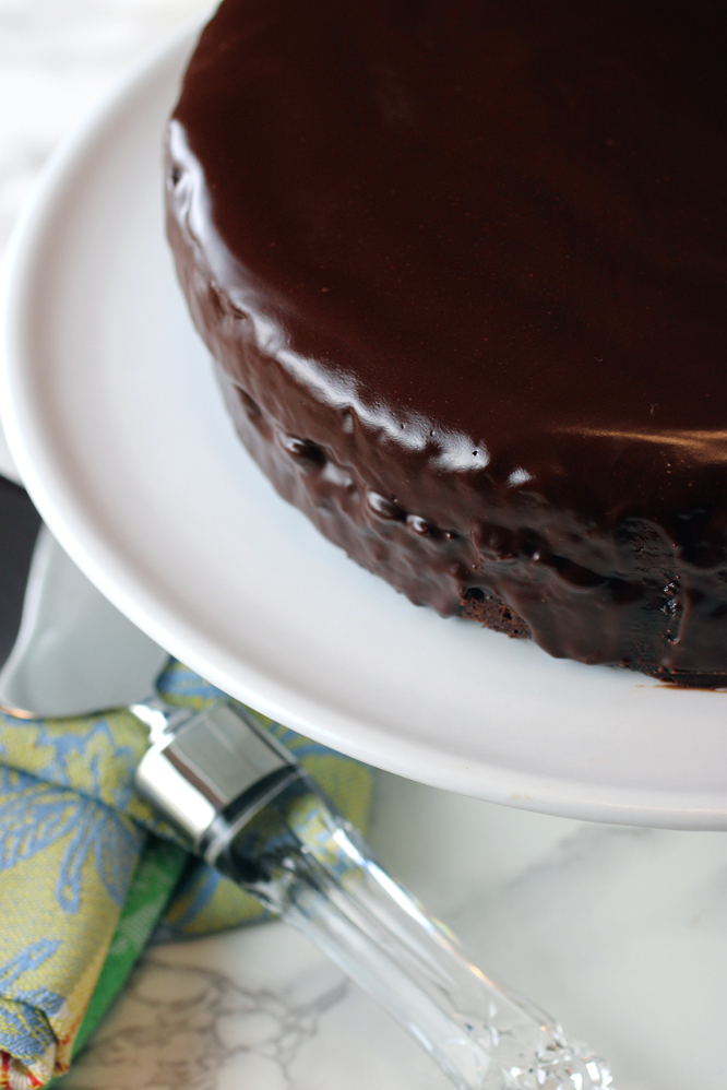 The smooth, shiny, chocolate-glazed cake.