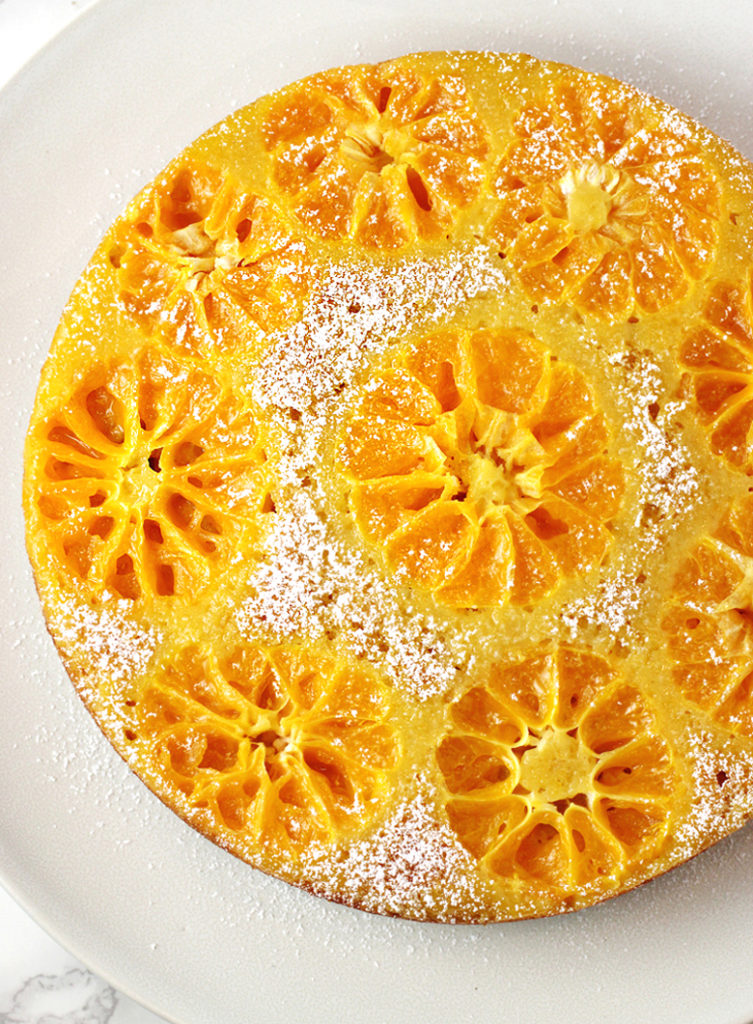 Sliced clementines decorate the top of this upside-down cake so very prettily.