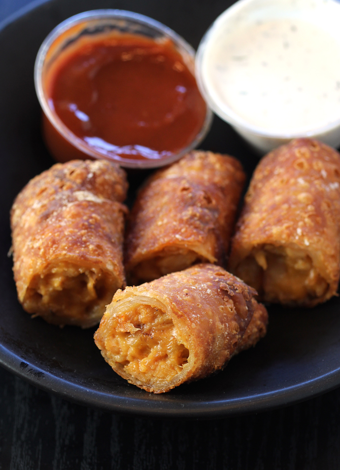 Crispy barbecue chicken spring rolls with a center of gooey cheese.