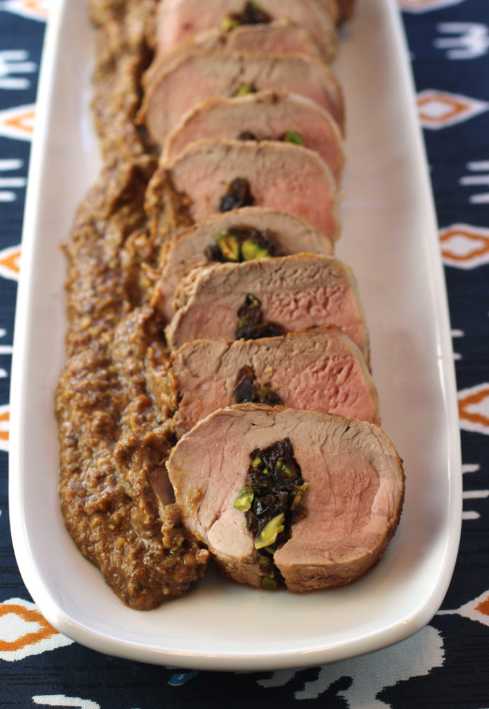 Pistachios and prunes make up the filling and the sauce for this simple pork tenderloin roll.