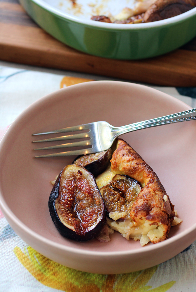 The batter puffs up to cradle the figs softly.