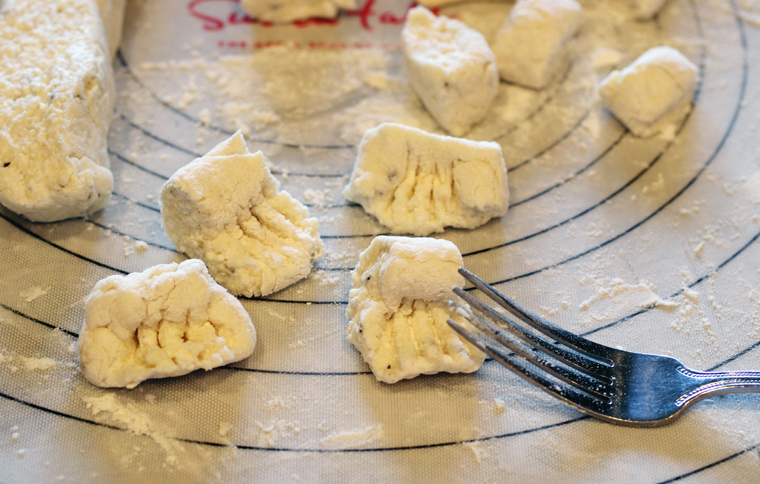 It may take one or two before you get the hang of rolling the gnocchi with the fork tines. But once you get the rhythm, it's a cinch.