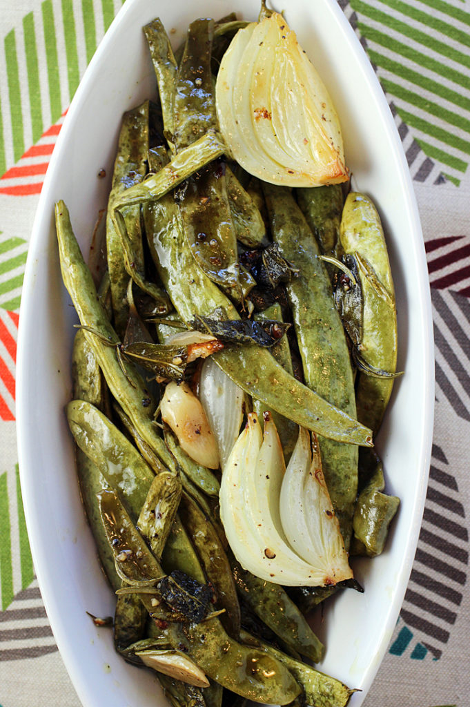 Romano beans turn ever so soft and juicy in the heat of the oven.
