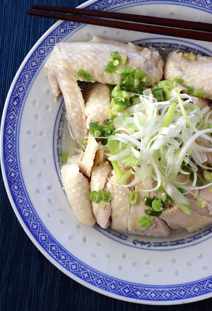 Classic poached chicken with a vibrant scallion-ginger sauce.