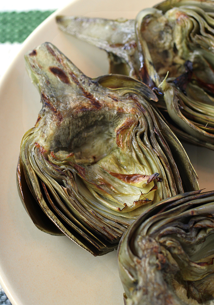 Grilling or searing adds a lovely color to the artichokes.