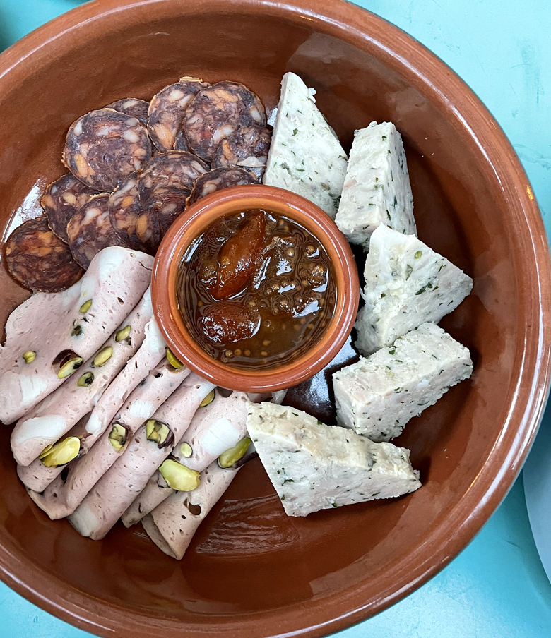 House-made rabbit terrine shines in this charcuterie sampler at La Bande.