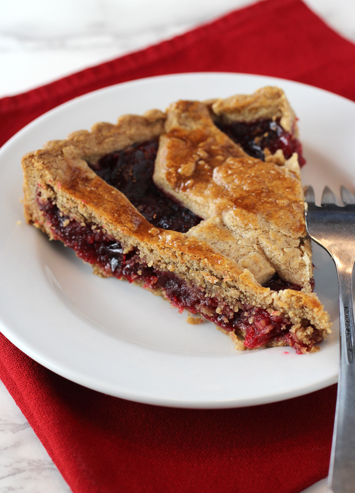 A toasty, nutty crumbly double-crust full of warm spices nestles a jammy filling.