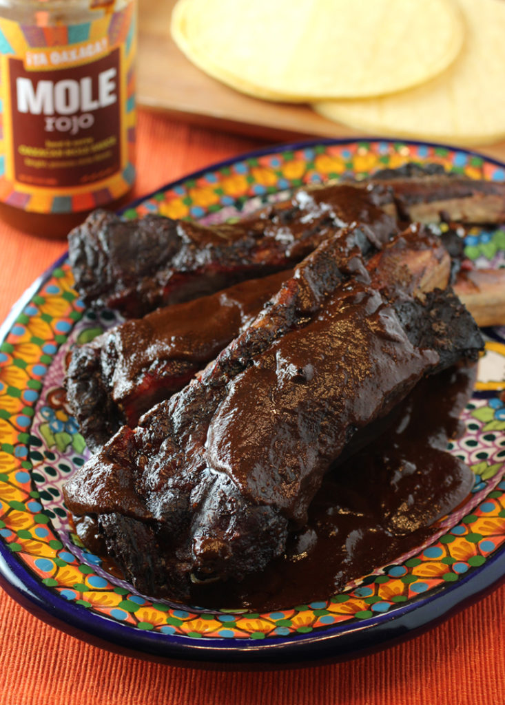 Big, beefy ribs get a big hit of spiciness and earthiness from ¡Ya Oaxaca! Mole Rojo.