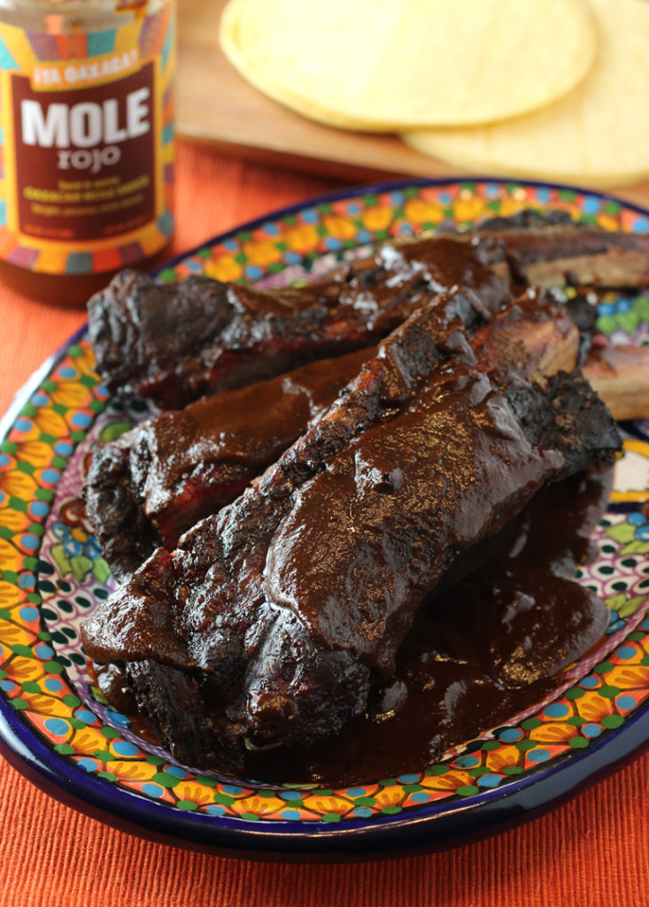 Big, beefy ribs get a big hit of spiciness and earthiness from Â¡Ya Oaxaca! Mole Rojo.