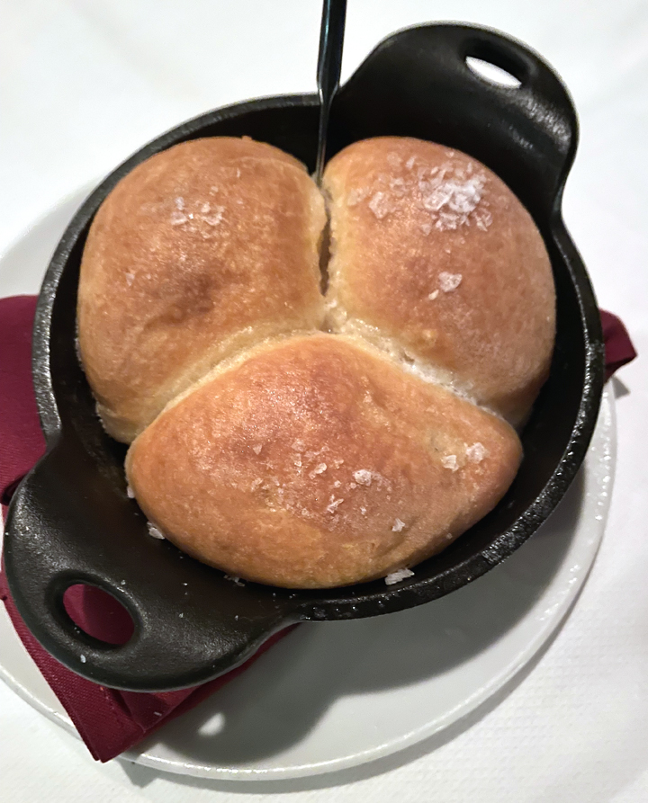 Butter-laden Parker House rolls baked to order.