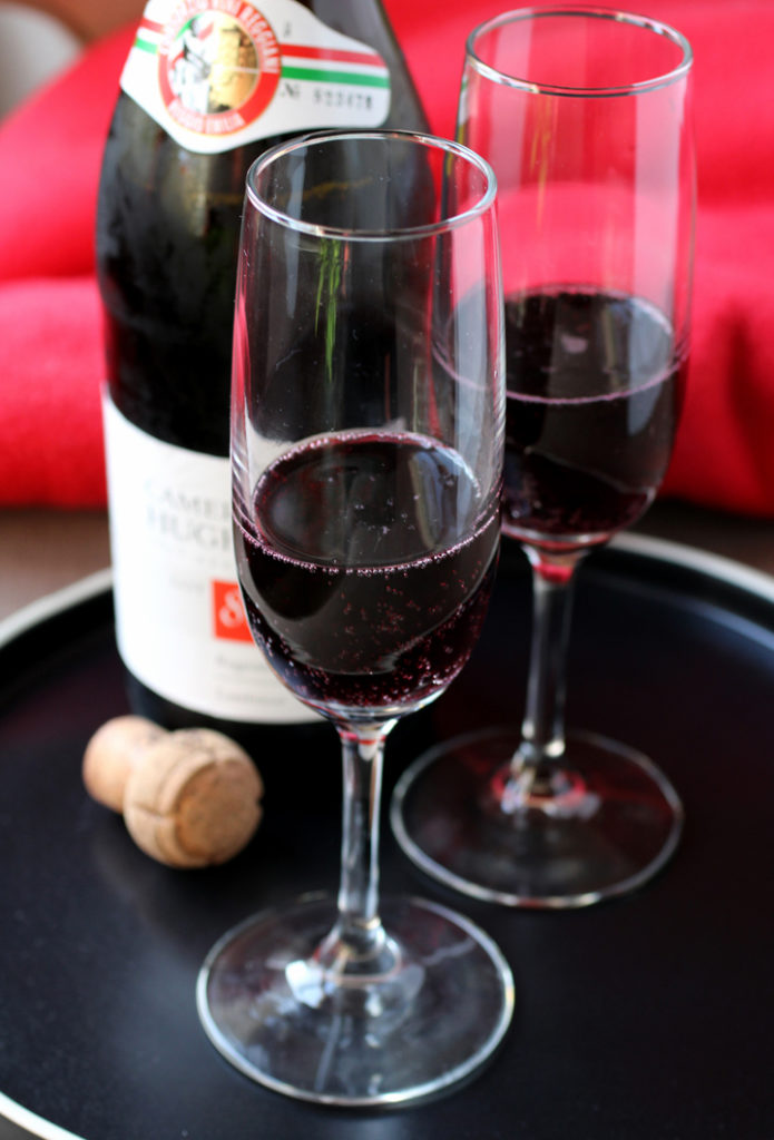 Deep, dark ruby and slightly fizzy in the glass, this Lambrusco is made for celebrations.
